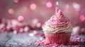 Celebratory Birthday Cupcake with Pink Decoration and Candle Royalty Free Stock Photo