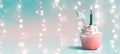 Cupcake with a lit candle Royalty Free Stock Photo