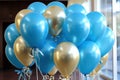 Celebratory Elegance: Blue and Gold Balloons Floating in the Air - Festive Atmosphere in Style