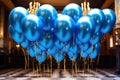 Celebratory Elegance: Blue and Gold Balloons Floating in the Air - Festive Atmosphere in Style