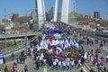 A celebratory parade in honor of the first Maya. people walk on the bridge