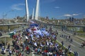 A celebratory parade in honor of the first Maya. people walk on the bridge