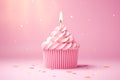 Celebratory Pink Birthday Cupcake with a Lit Candle Royalty Free Stock Photo