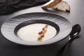 Celery cream soup in dark plate Royalty Free Stock Photo