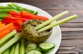 Celery and other vegetable sticks with dip sauce on wooden table, closeup Royalty Free Stock Photo