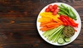 Celery and other vegetable sticks with dip sauce on wooden table, top view. Space for text Royalty Free Stock Photo