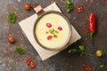 Celery root soup in copper cup on dark background. Royalty Free Stock Photo