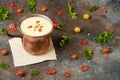 Celery root soup in copper cup on dark background. Royalty Free Stock Photo