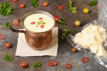 Celery root soup in copper cup on dark background. Royalty Free Stock Photo