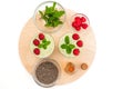 Celery spinach banana smoothie with Chia seeds, honey, fresh raspberries and mint leaves close up on wooden serving board Royalty Free Stock Photo