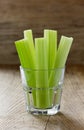 Celery stems on a wooden rustic board