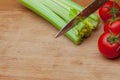 Celery and tomatoes on a cutting board Royalty Free Stock Photo