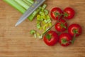 Celery and tomatoes on a cutting board Royalty Free Stock Photo