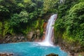 Celestial blue waterfall and pond in tenorio national park, Costa Rica Royalty Free Stock Photo