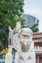 The celestial lion statue and Kwun Yam statue at Kwun Yam temple, Hong Kong