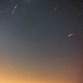 1565 Celestial Meteor Shower: A mesmerizing and celestial background featuring a meteor shower with shooting stars, cosmic dust,