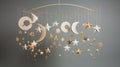 a celestial-themed mobile with golden stars and crescent moons suspended against a pure white backdrop