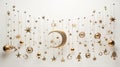 a celestial-themed mobile with golden stars and crescent moons suspended against a pure white backdrop