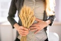 Celiac Disease And Gluten Intolerance. Women Holding Spikelet