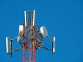 Cell antenna, transmitter. Telecom TV radio mobile tower against blue sky Royalty Free Stock Photo