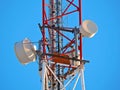 Cell antenna, transmitter. Telecom TV radio mobile tower against blue sky Royalty Free Stock Photo