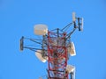 Cell antenna, transmitter. Telecom TV radio mobile tower against blue sky Royalty Free Stock Photo