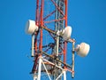 Cell antenna, transmitter. Telecom TV radio mobile tower against blue sky Royalty Free Stock Photo