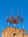 Cell phone antenna, transmitter. Telecom radio mobile antenna against blue sky Royalty Free Stock Photo