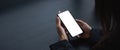 cell phone blank white screen mockup. woman hand holding texting using mobile on desk at office.background empty space Royalty Free Stock Photo