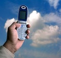 Cell phone and blue sky Royalty Free Stock Photo