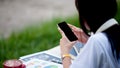 cell phone happy woman resting Enjoy Internet browsing data. or use a mobile software application Communicate with friends on