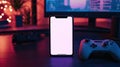 Cell phone mockup image blank white screen. Mobile phone on desk, gamepad on a dark background Royalty Free Stock Photo