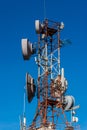 Cell phone relay tower in a bright sunny day. Clear blue sky in
