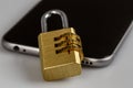 Cell phone security - lock and phone on white Royalty Free Stock Photo