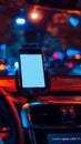 A cell phone sitting on the dashboard of a car at night Royalty Free Stock Photo