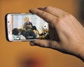 Cell phone takes image of Former President Bill Clinton Speaks a Royalty Free Stock Photo