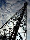 Cell phone tower and the cloudy sky Royalty Free Stock Photo