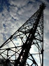 Cell phone tower and the cloudy sky