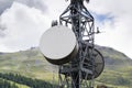 Cell phone transmitters on telecommunication tower in mountains Royalty Free Stock Photo