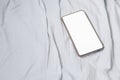 Cell phone on white bed in Interior train with copy space add text Royalty Free Stock Photo