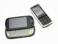 Cell phones evolution. Two different style,model and generation of cell phones on white background Royalty Free Stock Photo