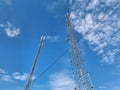 Cell towers against a blue sky. Two cell towers on blue background Royalty Free Stock Photo