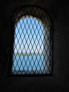 Cell wall with a window with bars with sea view, interior perspective Royalty Free Stock Photo