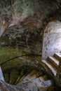 Cellar spiral steps with side window light Royalty Free Stock Photo