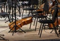 The cello lies on the stage next to the classical instruments Royalty Free Stock Photo