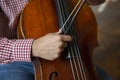 Cello playing cellist hands close up orchestra instruments Royalty Free Stock Photo