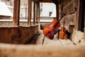 Cello and violin leaning on a porch Royalty Free Stock Photo