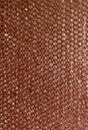 Plastic background texture cellophane wrapping packing wrap packet bead ball color maroon bordo brown chocolate Royalty Free Stock Photo
