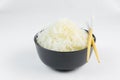 Cellophane rice noodles in a black bowl with chopsticks on white background, isolate, side view, closeup Royalty Free Stock Photo