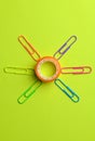 Cellophane tape circled with colored paper clips. Scotch tape Royalty Free Stock Photo